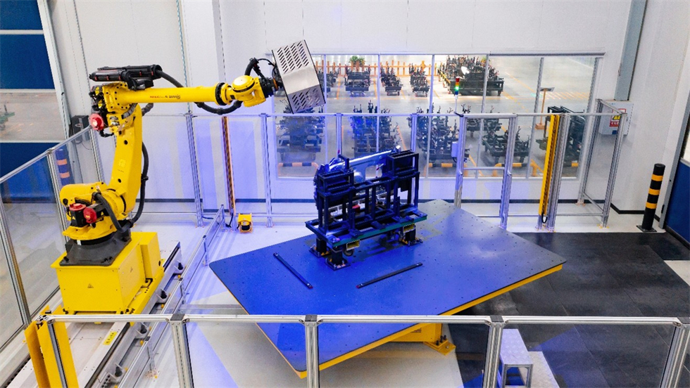 A robotic arm holding a blue and yellow objectAI-generated content may be incorrect.